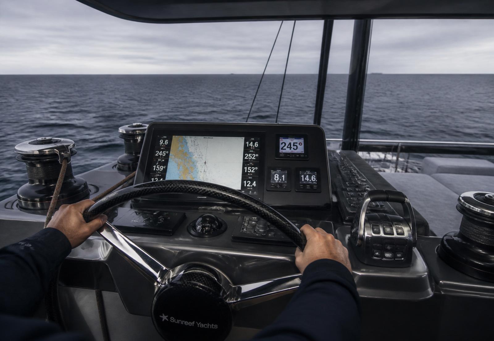 Sunreef helm station with professional skipper at the wheel